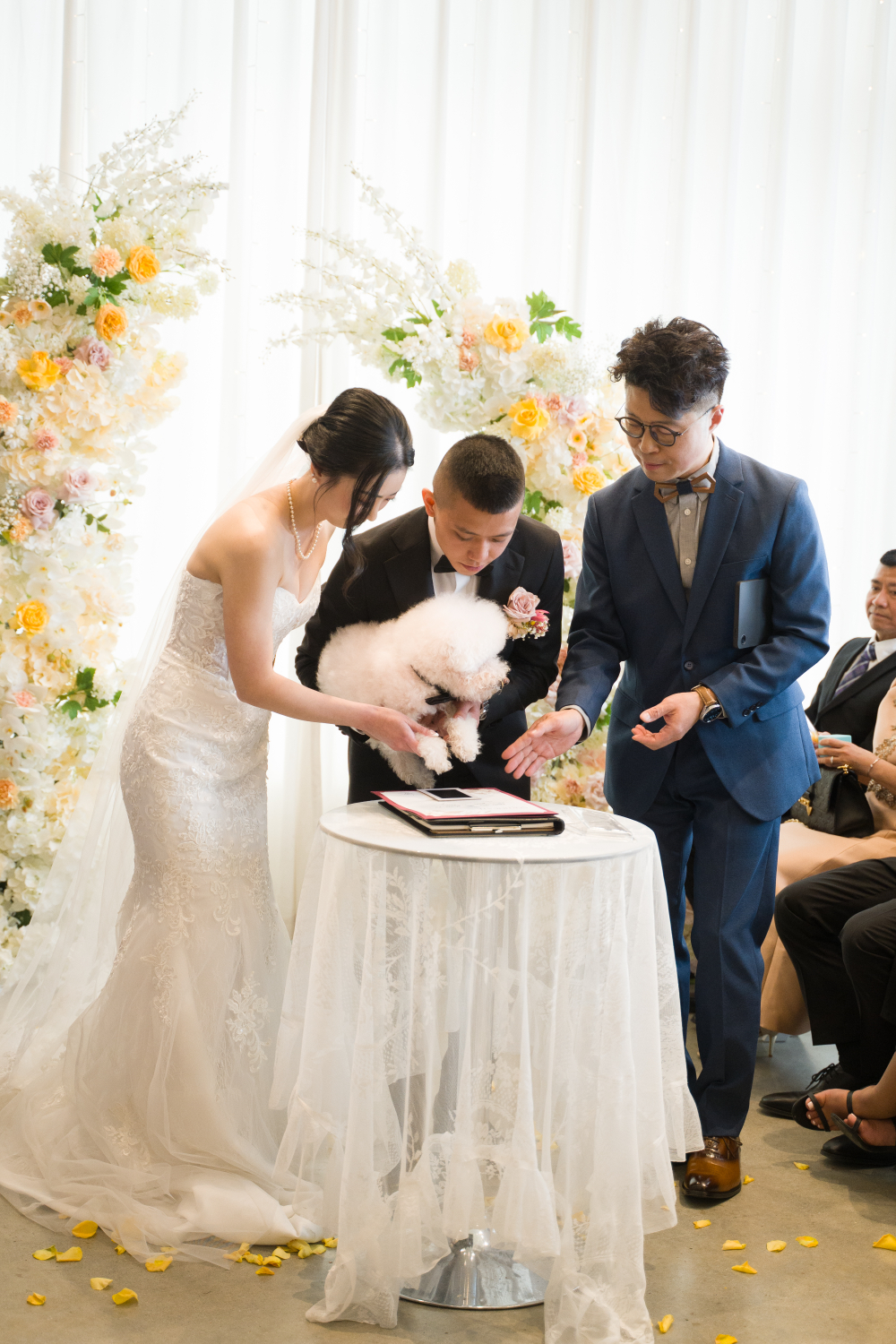 A couple and their dog creating a Paw Print Unity Certificate with their celebrant
